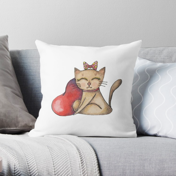 Cuscino con illustrazione cute di un gatto con un fiocco in testa rosa e un cuore rosso accanto
